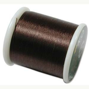 May include: A spool of brown thread for sewing or embroidery.