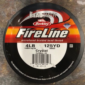May include: A spool of 4lb, 125 yard FireLine Crystal microfused braided bead thread fishing line. The spool is red and black with the Berkley logo and the text "The Beadsmith" on it.