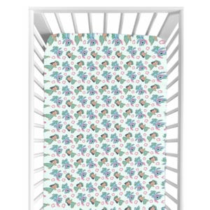 May include: A cot sheet featuring a repeating pattern of a cartoon character in blue, green, and pink on a pale green backdrop. The sheet is inside a white cot.