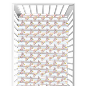 May include: A fitted crib sheet with a repeating pattern of a cartoon elephant wearing a yellow hat and pink outfit. The background has alternating light blue, gray, and white stripes. The sheet is inside a white crib.