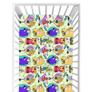 May include: A light green crib sheet featuring a repeating pattern of cartoon characters in various poses. The characters are in bright colors, including purple, yellow, red, and blue, set against geometric shapes and zig-zag lines. The sheet is inside a white crib.