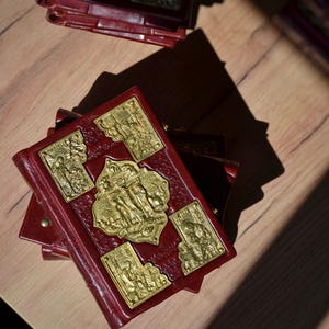 The Holy Gospel with brass overlays