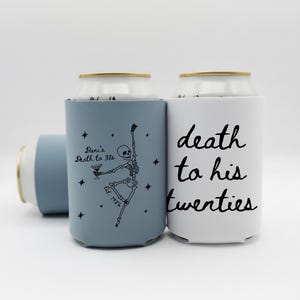 May include: Three can coolers in a light blue and white color scheme. One cooler has the text "death to his twenties" in black script. Another cooler has a skeleton graphic and the text "Dani's Death to 30s".