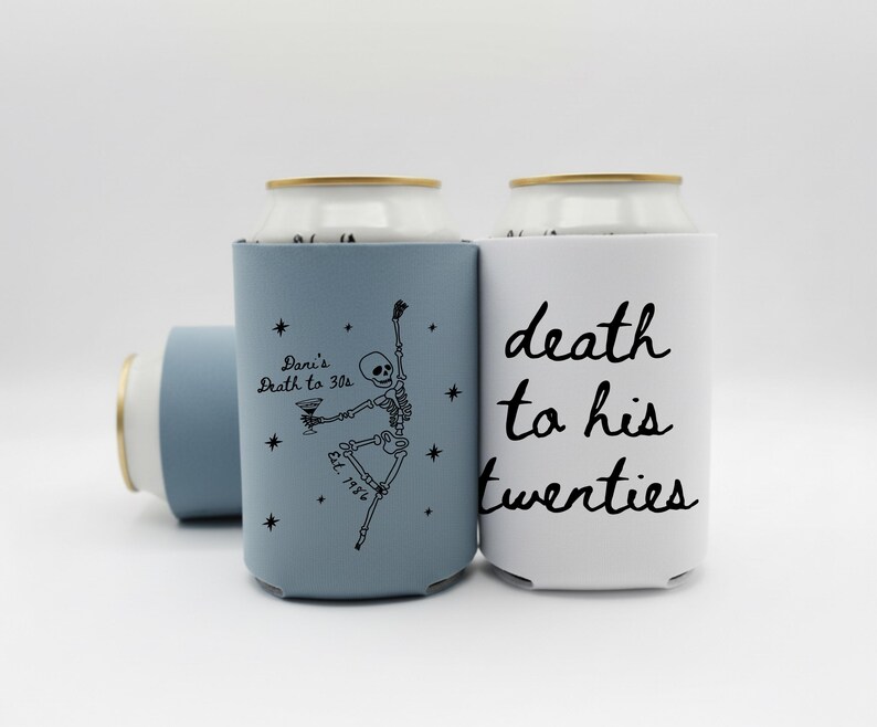 May include: Three can coolers in a light blue and white color scheme. One cooler has the text "death to his twenties" in black script. Another cooler has a skeleton graphic and the text "Dani's Death to 30s".