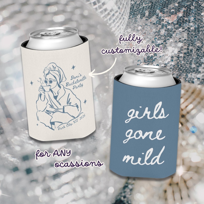 May include: Two can coolers. One is off-white with a blue illustration of a person in a robe, sunglasses, and a towel, holding a cup. Text reads "Dani's Bachelorette Party, Park City, UT 2025." The other is blue with "girls gone mild" in white.