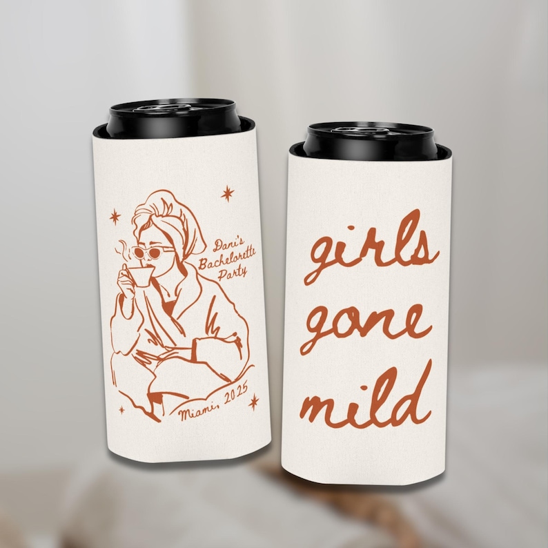 May include: Two white can coolers with black tops. One cooler features a brown illustration of a woman in a robe, sunglasses, and a towel on her head, with text that reads "Dani's Bachelorette Party Miami 2025". The other cooler says "girls gone mild" in brown script.
