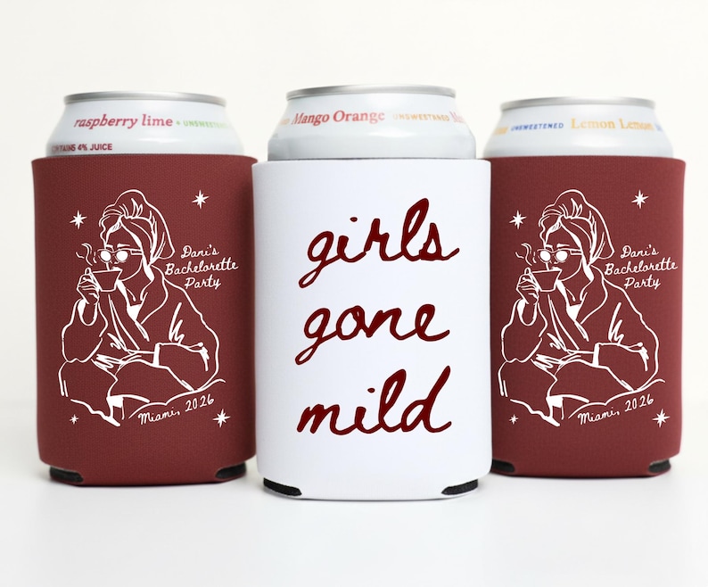 May include: Three drink koozies. Two are burgundy with a white illustration of a person in a robe, holding a cup, and the text "Dani's Bachelorette Party Miami, 2026". The center koozie is white with the text "girls gone mild" in burgundy.