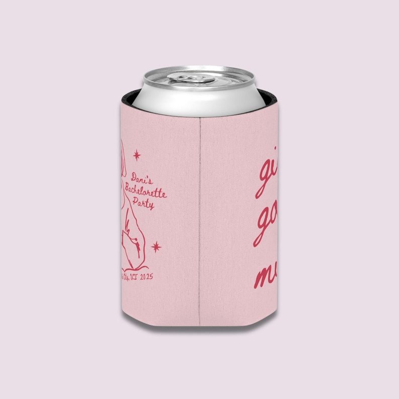 May include: A pink can cooler with a silver can inside. The cooler has red text that says "Dani's Bachelorette Party" and "girls go mad". The date "NY 2025" is also printed on the cooler.
