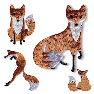 May include: A collection of embroidered fox patches. The patches depict foxes in different poses, with orange and white fur and black detailing. One fox is seated, others are leaping or in other positions. These patches are suitable for adding a nature theme to items.