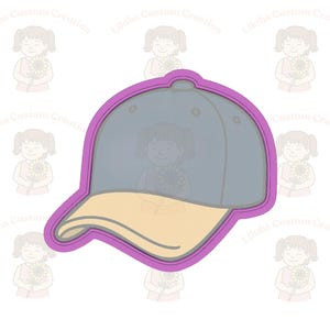 May include: A baseball cap cookie cutter with a light blue crown and a tan brim, outlined in purple. The background features a repeating pattern of a girl holding a sunflower, with the text "Lilahs Custom Creation".