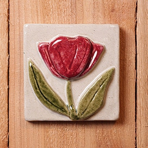 Handmade 4x4 ceramic relief red Tulip tile comes with a hanger on the back, suitable for a tile installation