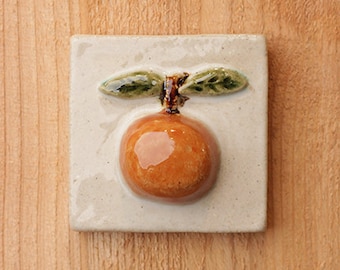 Handmade ceramic orange tile, high relief 3x3 with hanger on the back