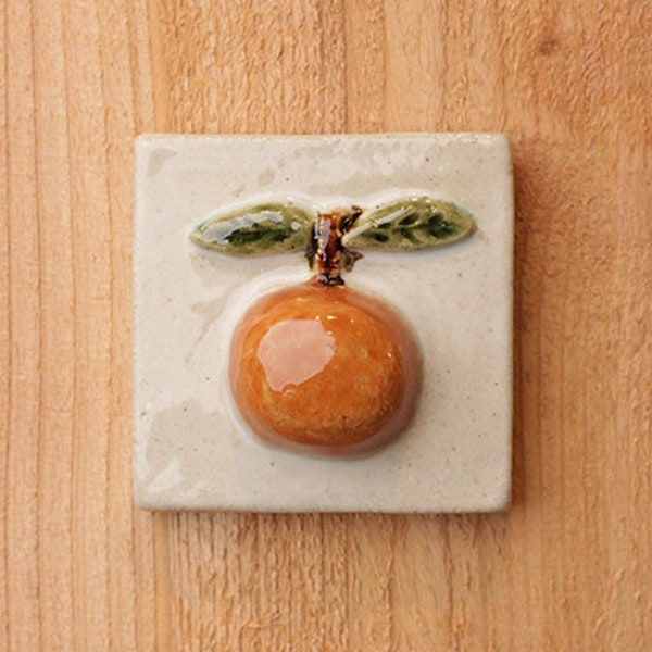 Handmade ceramic orange tile, high relief 3x3 with hanger on the back