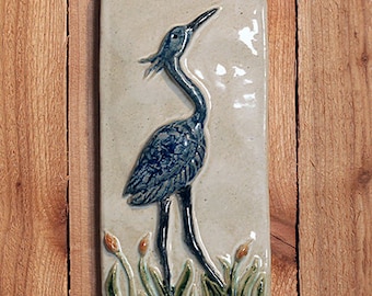 Handmade 4x8 ceramic Blue Heron tile comes with a hanger on the back