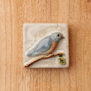 Handmade 2x2 ceramic bluebird tile comes with a hanger on the back