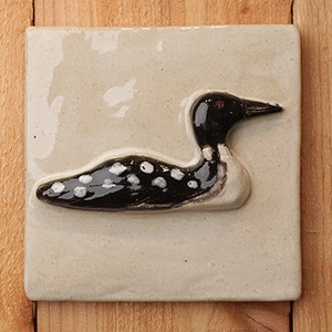 Handmade 6x6 ceramic Loon tile comes with a hanger on the back