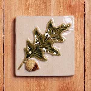 Handmade 4x4 ceramic relief Oak Leaf and Acorn tile comes with a hanger on the back, suitable for tile installation