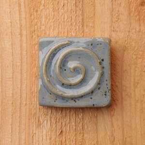 2x2" Handmade ceramic spiral tile with a hanger on the back or for tile installation