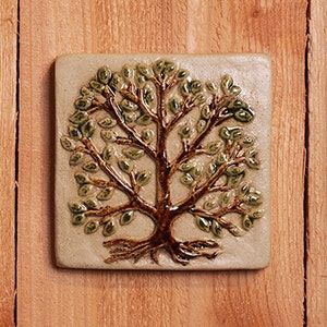 Handmade 4x4 ceramic tree tile comes with a hanger on the back, suitable for a tile installation