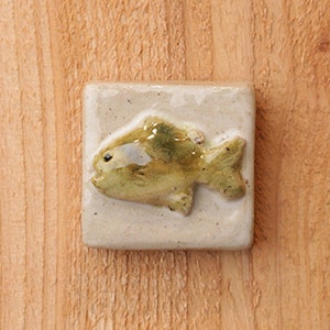 2x2" Handmade ceramic fish tile with a hanger on the back