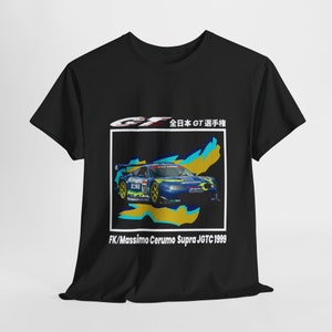 May include: Black t-shirt with a graphic of a blue and yellow race car with the text "GF 全日本GT選手権 FK/Massimo Cerumo Supra JGTC 1999"
