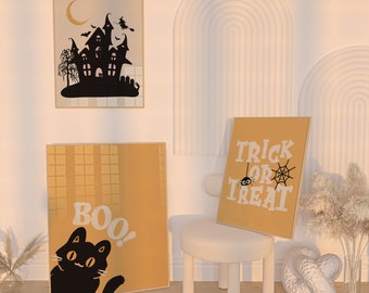 May include: Three Halloween-themed prints with a yellow background. The first print features a black silhouette of a haunted house with a crescent moon and bats. The second print says "BOO!" with a black cat peeking out from the side. The third print says "TRICK OR TREAT" with a spider and web.