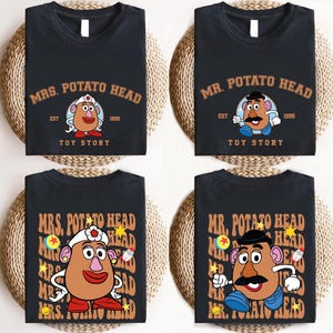 four black t-shirts with the same design featuring the characters from the animated television series "Mr. Potato Head".