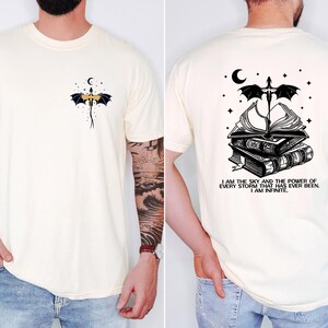 The image is a collage of two photos of a man wearing a white t-shirt with a dragon and a book design on the back.