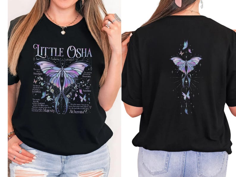 A woman wearing a black t-shirt with a butterfly design and text on it.