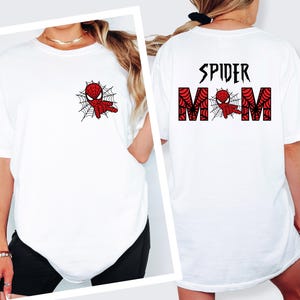 A white t-shirt with a Spider-Man design and the text "SPIDER MOM" printed on the back.