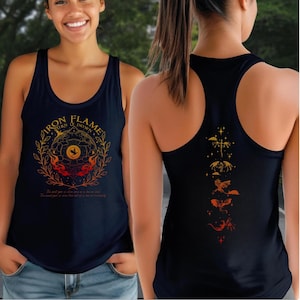 A woman wearing a black tank top with a graphic design on the front and back.