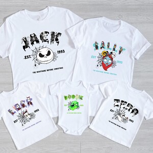 a group of three t - shirts on a wooden floor