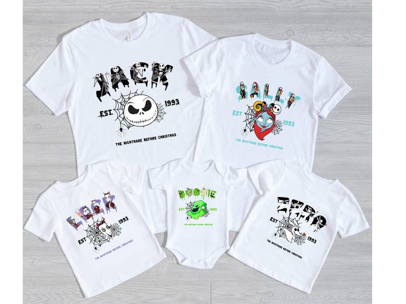 a group of three t - shirts on a wooden floor
