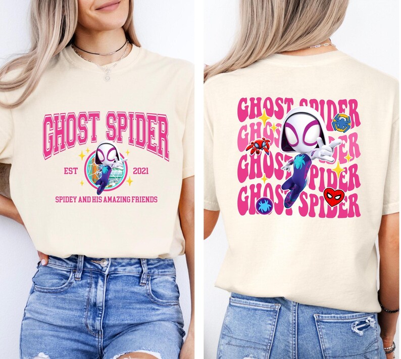 a woman wearing a white t-shirt with a graphic design of a character from the Spider-Man franchise.
