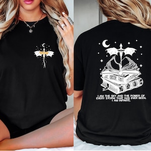The image is a collage of two photos. In the left photo, a woman with long blonde hair is sitting on a bed, wearing a black t-shirt with a dragon design and a quote on the back. In the right photo, the same woman is sitting on a bed, wearing a black t-shirt with a white dragon design and a quote on the back.