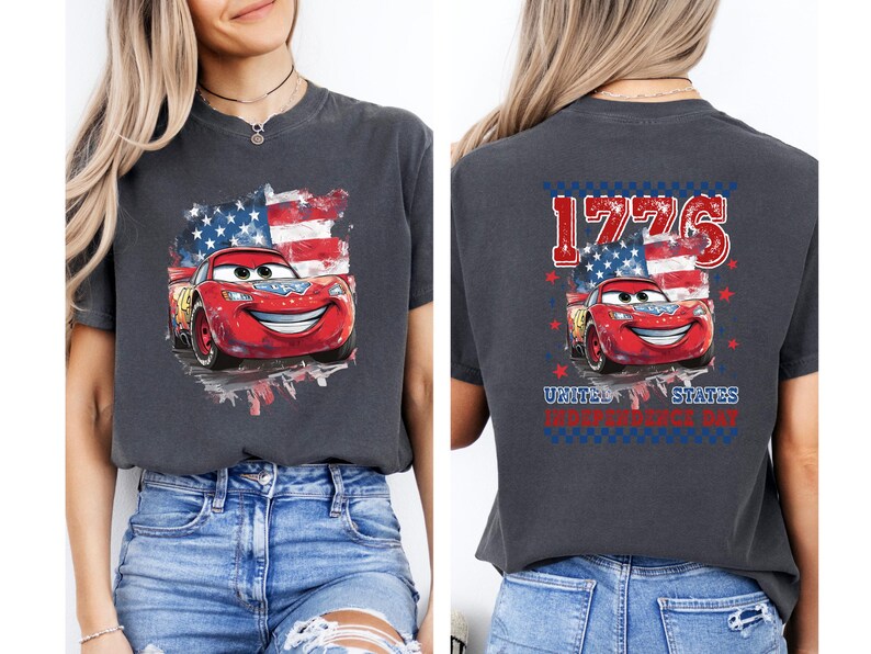 a woman wearing a t - shirt with cars on it