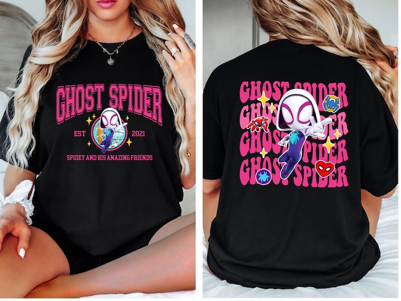 a woman wearing a black t-shirt with a graphic design of a spider character.