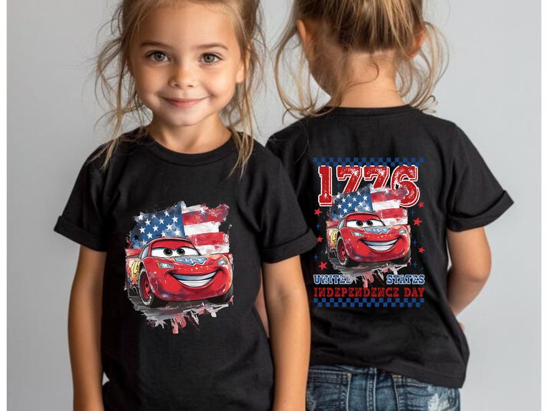 two little girls wearing matching cars t - shirts