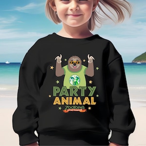 May include: Black sweatshirt featuring a cartoon sloth wearing sunglasses and a green shirt with a globe design. The text "PARTY ANIMAL" and "ZOOTOPIA" are printed below the sloth, with star accents. The phrase "BETTER TOGETHER" is also included.