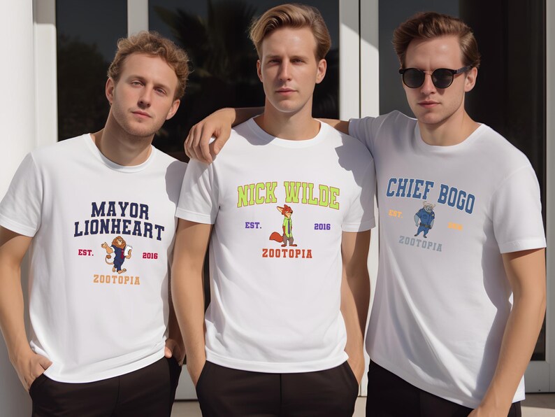 Three young men wearing white t-shirts with colorful designs and text, standing together.