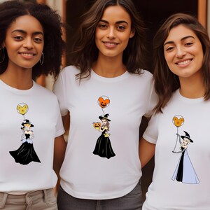three women wearing t - shirts with cartoon characters on them