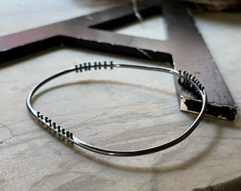 Hammered kinetic oxidized sterling silver bangle bracelet