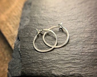 Tiny sterling silver hammered hoops