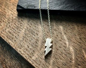 Tiny sterling silver lightening bolt charm sterling silver