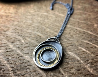 Oxidized sterling silver and 18k yellow gold concentric circles pendant Orbit