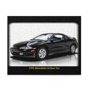 May include: A black 1995 Mitsubishi Eclipse Gsx sports car. The car is glossy and has silver rims. The image is a puzzle with a black border and white background.