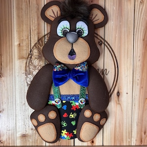 May include: A set of three ceramic mugs with a speckled, matte finish. The mugs are in shades of cream, light gray, and dark gray. Each mug has a simple, minimalist design, perfect for coffee or tea.