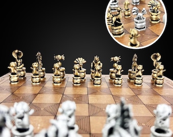 May include: A gold and silver chess set with pieces shaped like mythical creatures. The chessboard is made of wood with a brown and white checkered pattern.