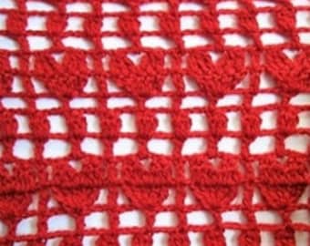 May include: Red crochet fabric with a repeating heart pattern.