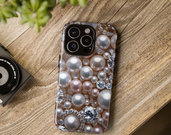 May include: A smartphone case adorned with a luxurious design. The case features a pattern of white and pink pearls, interspersed with sparkling clear crystals. The case is set against a wooden surface.